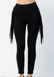 Black fringed pants on a white background