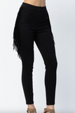 Black fringed pants on a white background