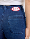 Blue jeans with a 'Judy B.' patch on the back pocket